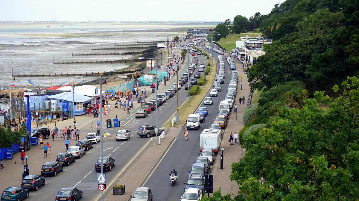Aerial view of a busy road and promenade at Southend-on-Sea, featuring cars and people.